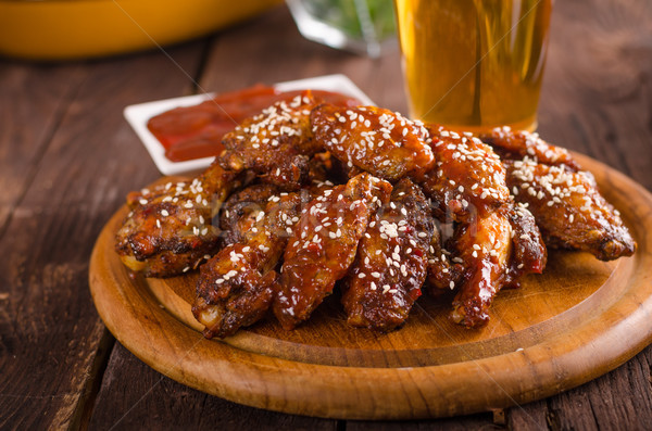 Grilled chicken wings with hot sauce Stock photo © Peteer