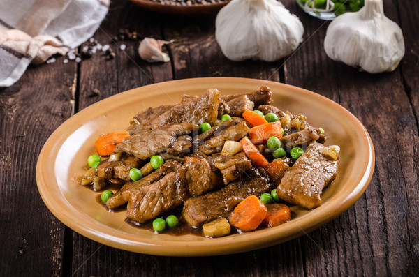 Pork medallions with vegetable and soy garlic sauce Stock photo © Peteer