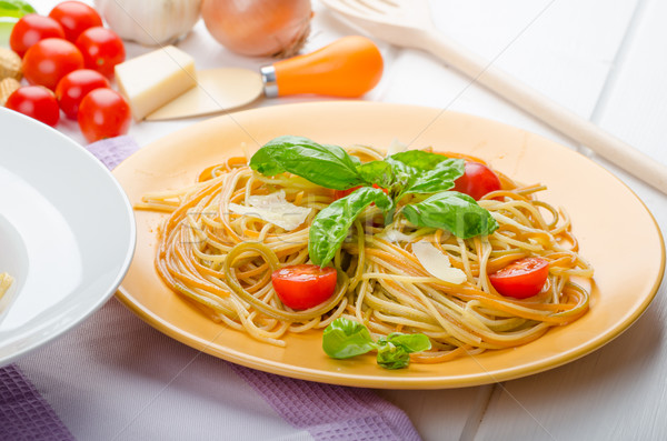 Lemon pasta with cherry tomatoes, basil and nuts Stock photo © Peteer