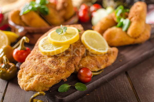 Stock photo: Chicken schnitzel with croquettes