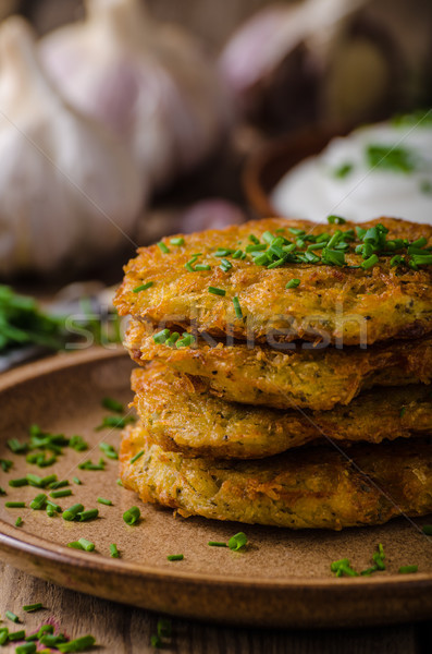 Potato pancakes with sour cream Stock photo © Peteer