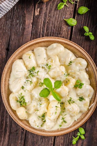 Cheese gnocchi with blue cheese sauce and galic Stock photo © Peteer