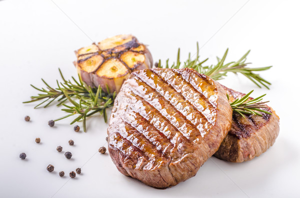Steak with garlic, pepper and herbs Stock photo © Peteer
