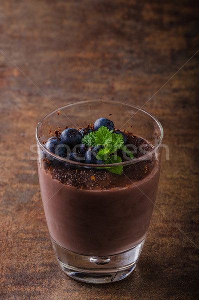 Chocolate pudding with berries and herbs Stock photo © Peteer