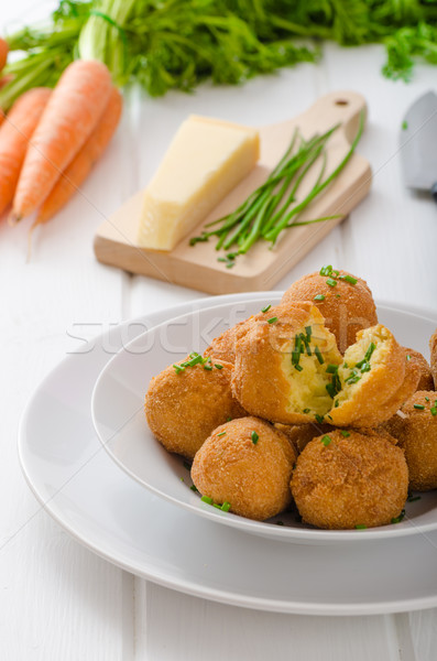 Homemade potato croquettes with parmesan and chives Stock photo © Peteer