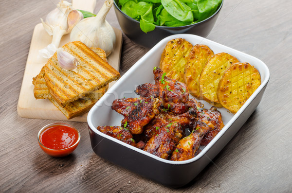 Sticky chicken wings with garlic panini bread Stock photo © Peteer