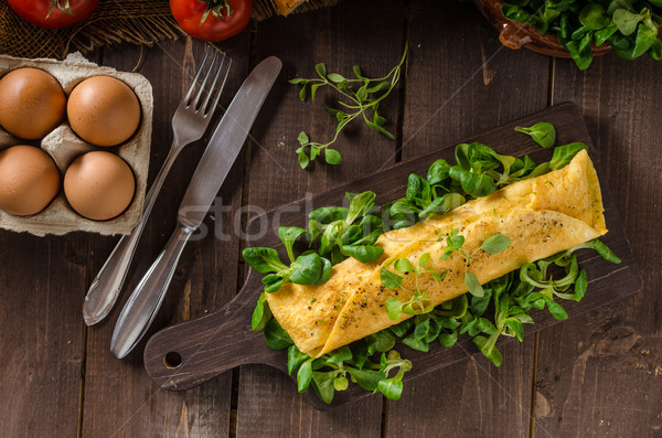 French omelet, fluffy, fresh eggs and herbs Stock photo © Peteer