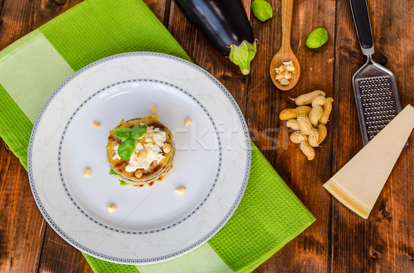 Grilled eggplant with feta cheese,parmesan basil, nuts Stock photo © Peteer