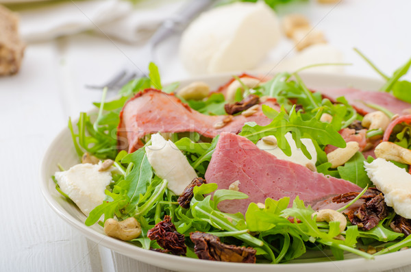 Stock photo: Arugula salad with meat and mozzarella