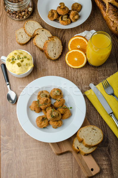 Breaded fried mushrooms with juice Stock photo © Peteer