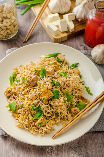 Chinese noodles with tofu and cashew nuts Stock photo © Peteer