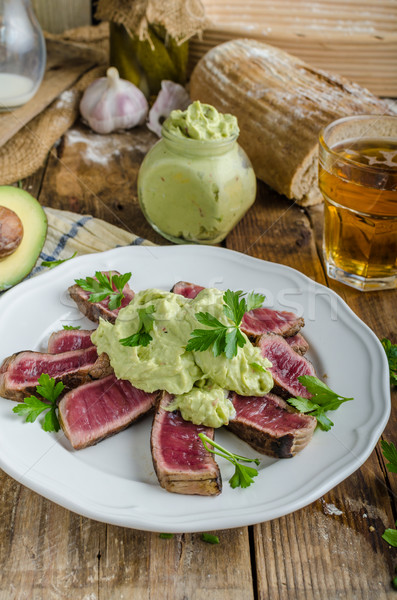 Beef steak with avocado dip and herbs Stock photo © Peteer