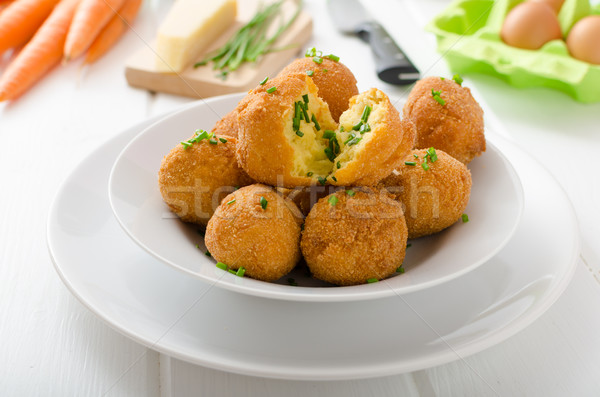 Homemade potato croquettes with parmesan and chives Stock photo © Peteer