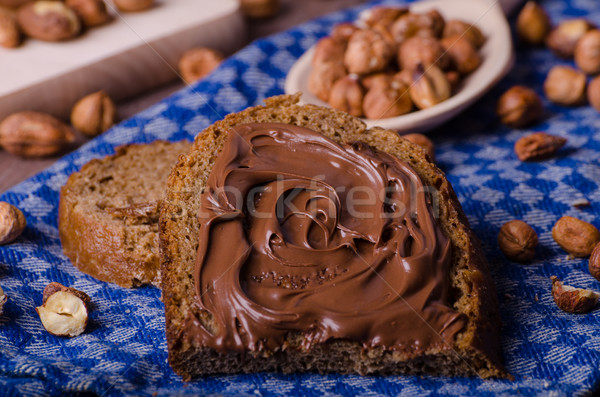 Healthy bread with Chocolate spread and nuts Stock photo © Peteer