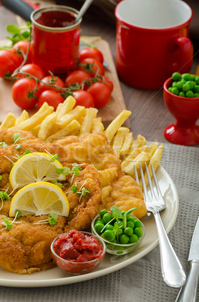 Schnitzel, french fries and microgreens salad Stock photo © Peteer
