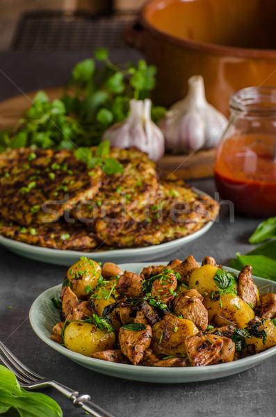 Potato pancakes, fried chicken with potatoes Stock photo © Peteer