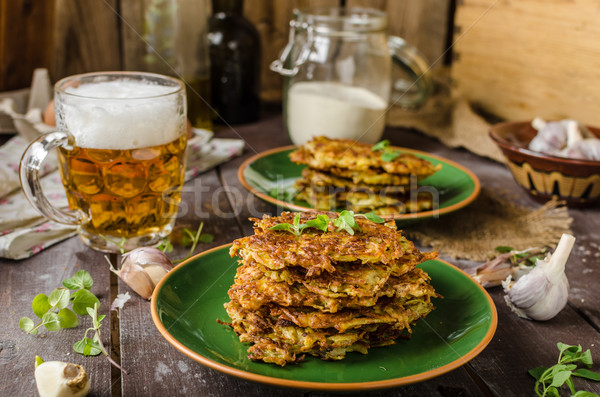 Potato pancakes with garlic and beer Stock photo © Peteer