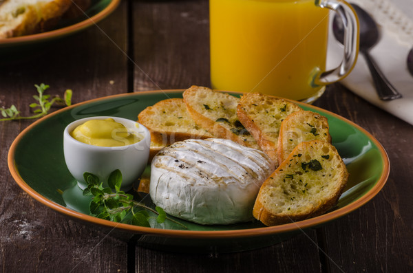 Grilled camembert with toast and juice Stock photo © Peteer