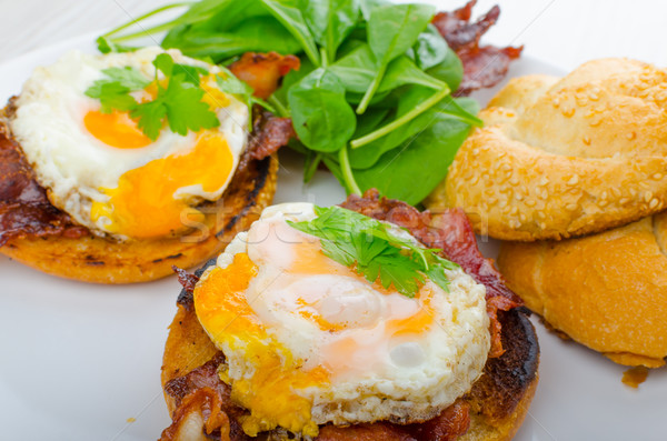 Eggs benedict with bacon and spinach Stock photo © Peteer