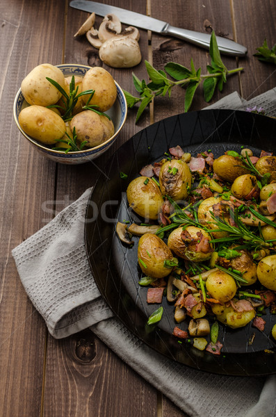 Cowboy potatoes with bacon and herbs Stock photo © Peteer