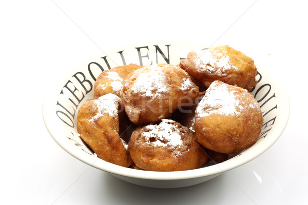 freshly baked traditional dutch oliebollen with powdered sugar Stock photo © peter_zijlstra