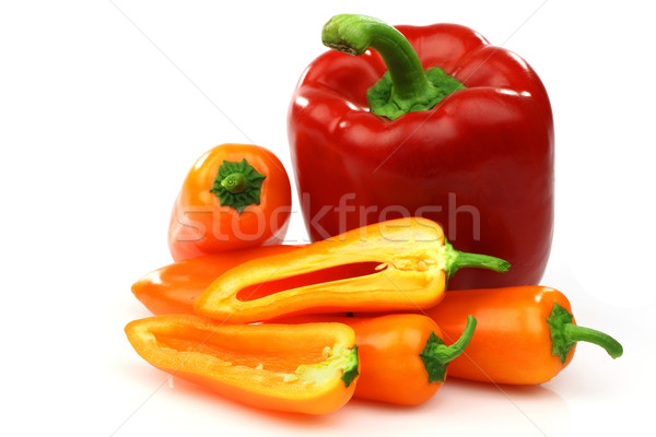 a fresh red and some orange peppers (capsicum) Stock photo © peter_zijlstra