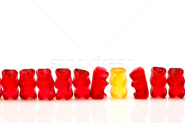 row of red gummy bears and a yellow one Stock photo © peter_zijlstra