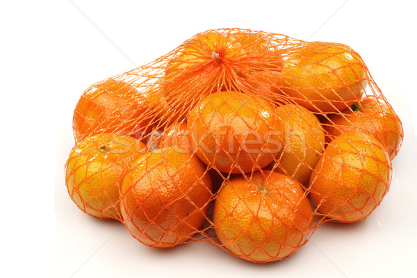 fresh tangerines in a red plastic net Stock photo © peter_zijlstra