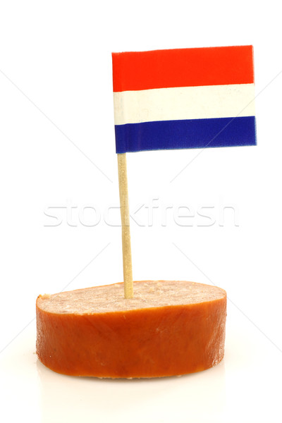 a piece of smoked sausage with a Dutch flag toothpick Stock photo © peter_zijlstra