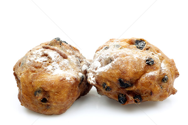 freshly baked traditional dutch oliebollen with currents and powdered sugar Stock photo © peter_zijlstra