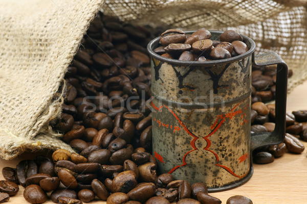 measuring cup  and a burlap bag with coffee beans  Stock photo © peter_zijlstra