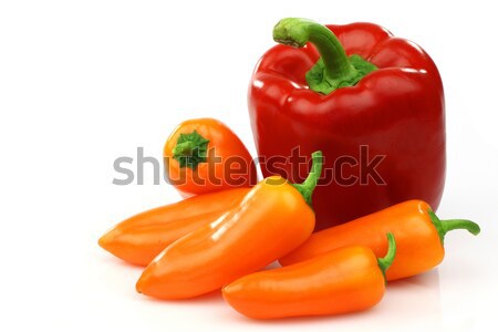 a fresh red and some orange peppers (capsicum) Stock photo © peter_zijlstra