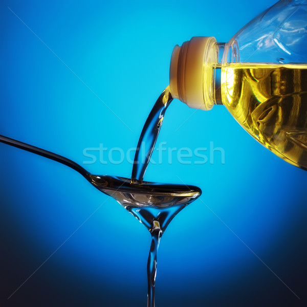 pouring oil Stock photo © PetrMalyshev