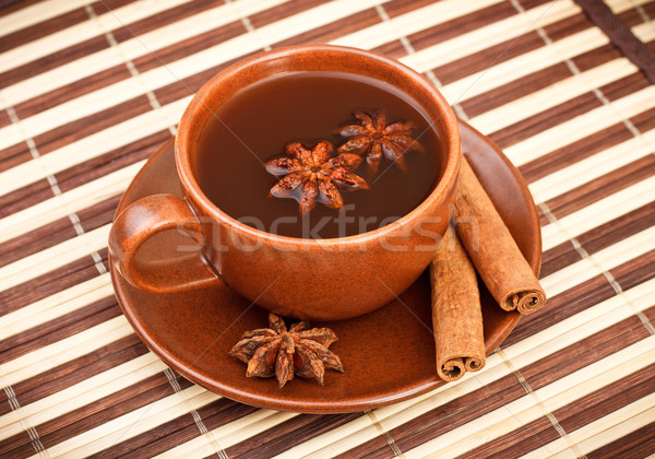 tea with cinnamon sticks and star anise Stock photo © PetrMalyshev