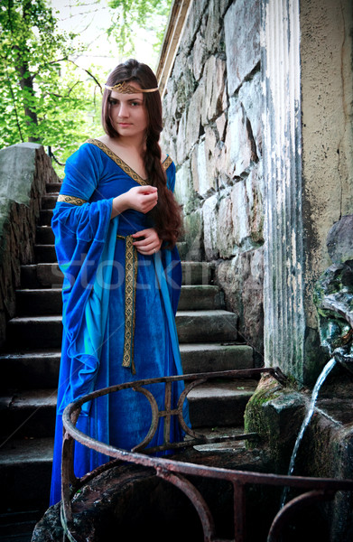 medieval girl next ancient spring Stock photo © PetrMalyshev