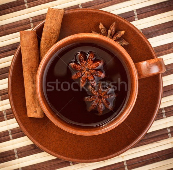 tea with cinnamon sticks and star anise Stock photo © PetrMalyshev