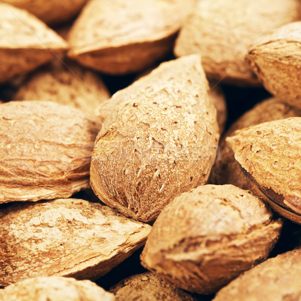 Unpeeled Almonds Nuts Background Stock photo © PetrMalyshev