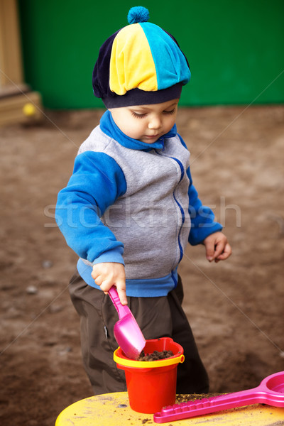 Boy Playing in Sandbox Stock photo © PetrMalyshev