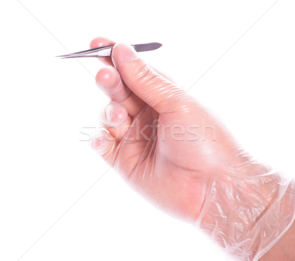 Stock photo: hand in rubber glove holding tweezers