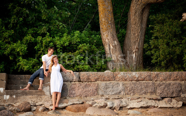 couple stand next stonewall in forest Stock photo © PetrMalyshev