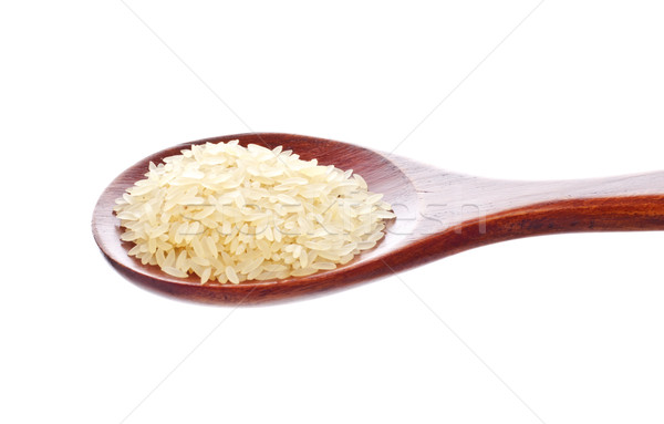 white rice in wooden spoon Stock photo © PetrMalyshev