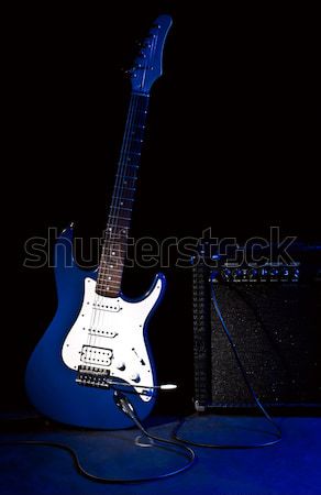 guitar and plug in spot of light Stock photo © PetrMalyshev