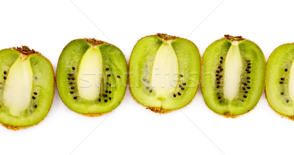 kiwi halves laying in row Stock photo © PetrMalyshev