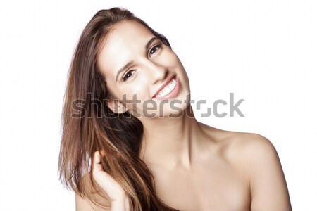 Happy woman touching hair Stock photo © phakimata