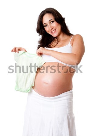 Pregnant woman holding baby shoes Stock photo © phakimata