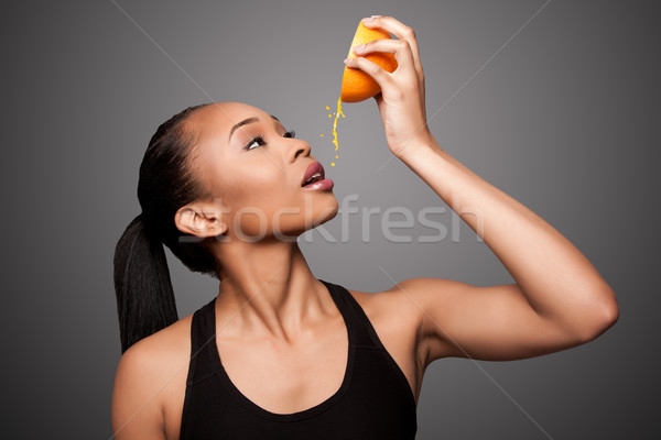 Felice sani nero asian donna succo d'arancia Foto d'archivio © phakimata