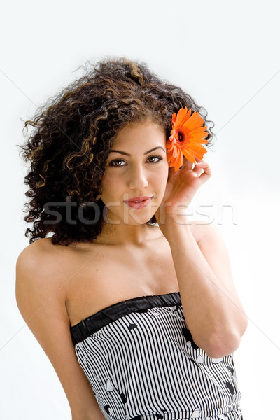 Young girl with flower Stock photo © phakimata