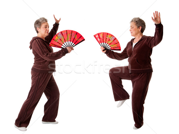 Senior woman doing Tai Chi Yoga exercise Stock photo © phakimata