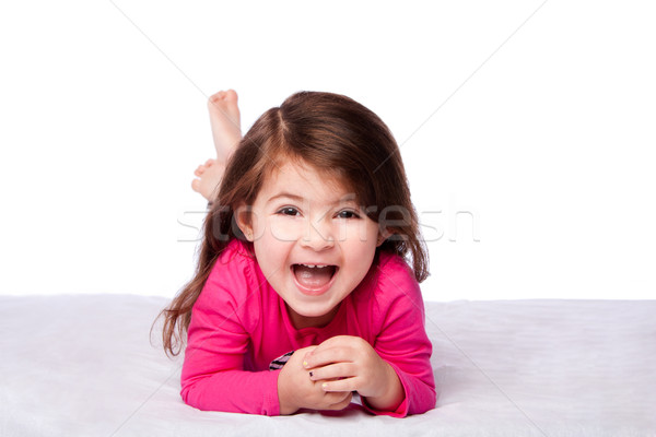Aranyos lány fektet has boldog nevet Stock fotó © phakimata
