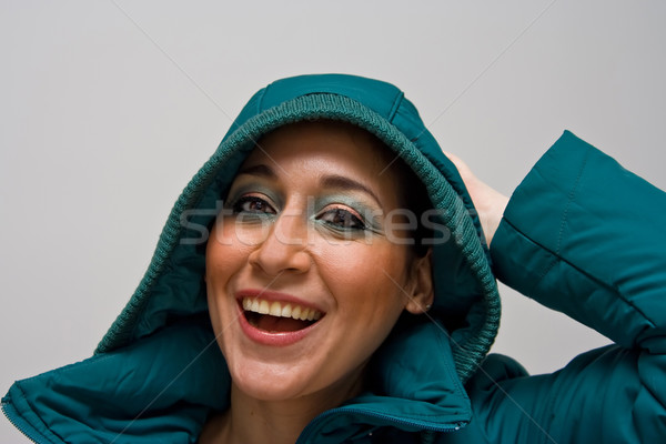 Stock fotó: Gyönyörű · kapucnis · fiatal · nő · mosolyog · visel · zöld